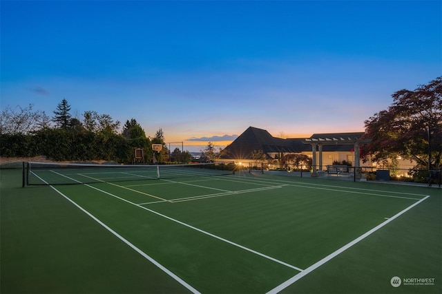 view of tennis court featuring a pergola