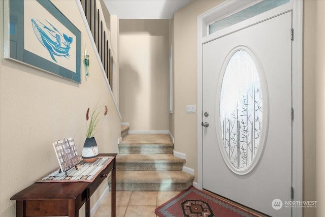 entrance foyer featuring light tile patterned floors