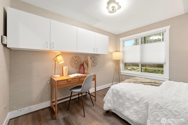 bedroom featuring dark hardwood / wood-style flooring