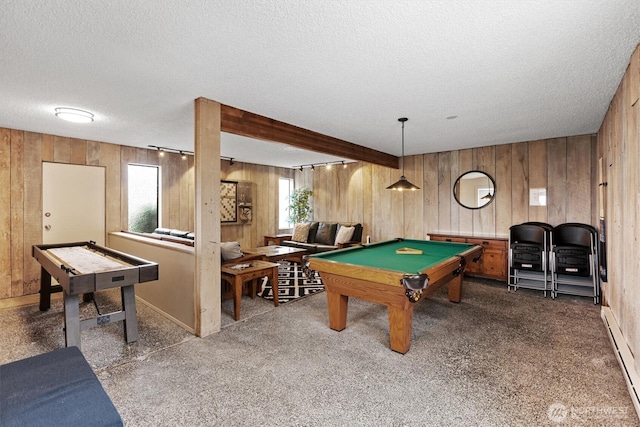 game room featuring a baseboard heating unit, pool table, a textured ceiling, and wood walls