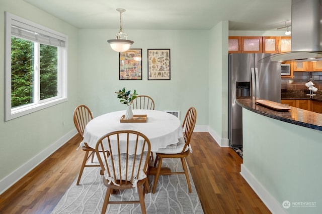 dining area featuring dark hardwood / wood-style floors