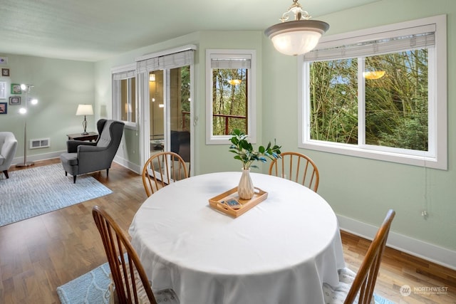 dining room featuring light wood-type flooring