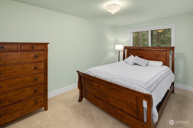 bedroom featuring light colored carpet