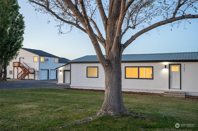 view of front facade with a front lawn and a garage