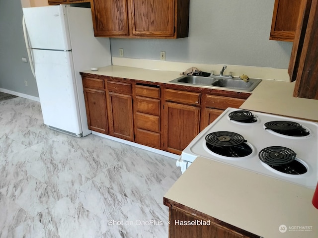 kitchen with white appliances and sink