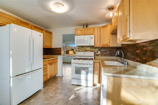 kitchen with white appliances, sink, decorative backsplash, and light brown cabinets