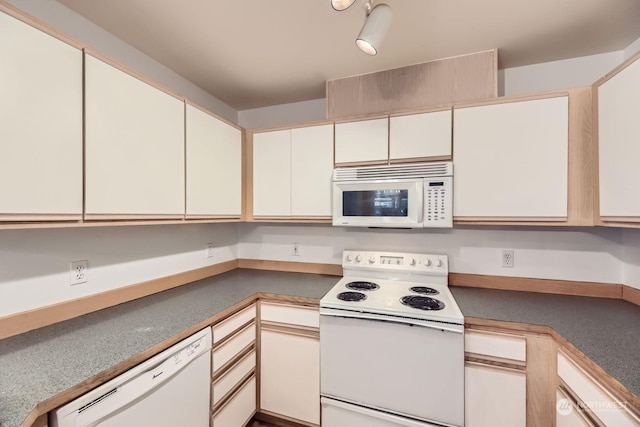 kitchen featuring white cabinetry and white appliances