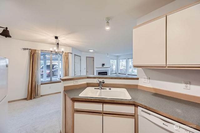 kitchen with white cabinetry, sink, light carpet, and dishwasher