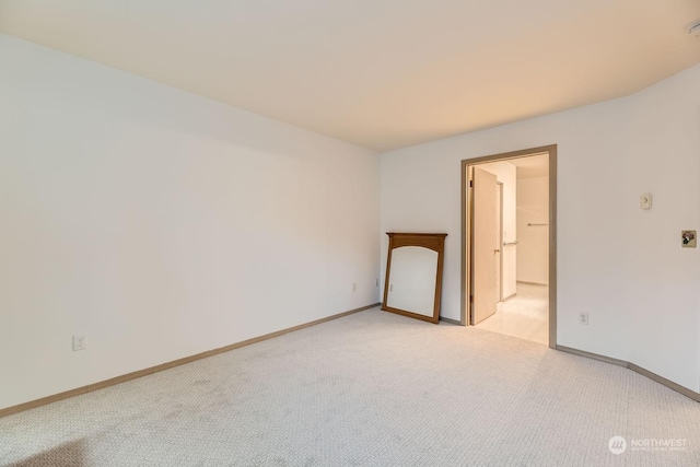 empty room featuring light carpet