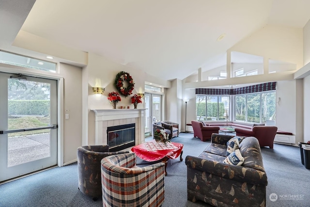 living room featuring carpet floors, a tile fireplace, and vaulted ceiling