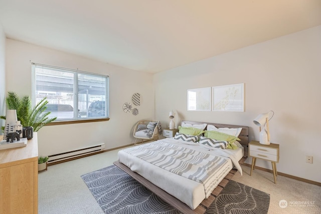 bedroom with light carpet and baseboard heating