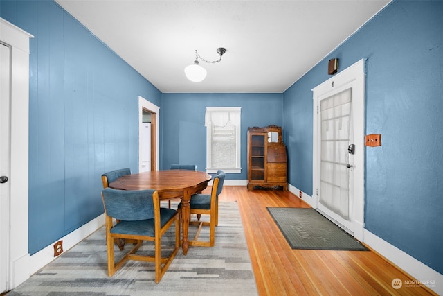 dining area with wood-type flooring