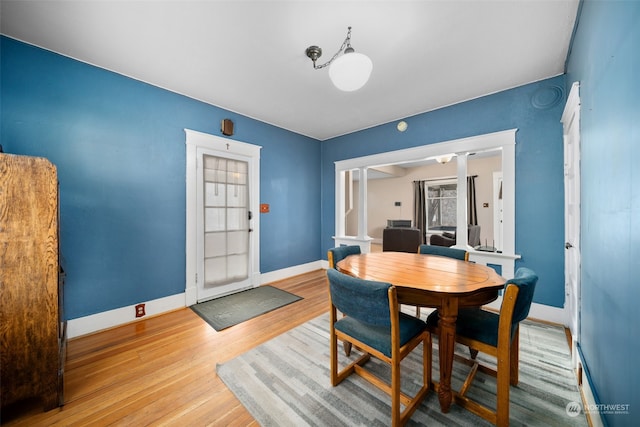 dining area with light hardwood / wood-style flooring