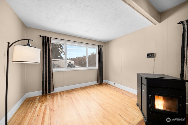 interior space featuring light hardwood / wood-style floors and a textured ceiling