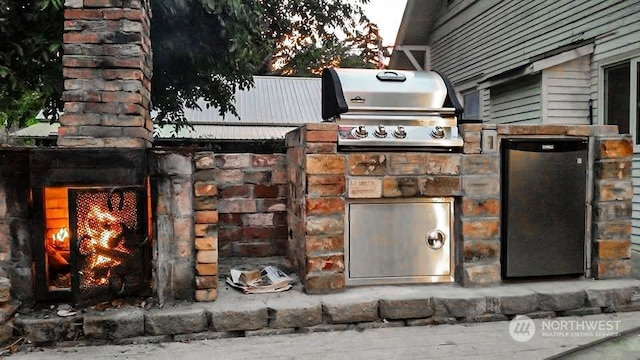 view of patio featuring a grill and exterior kitchen