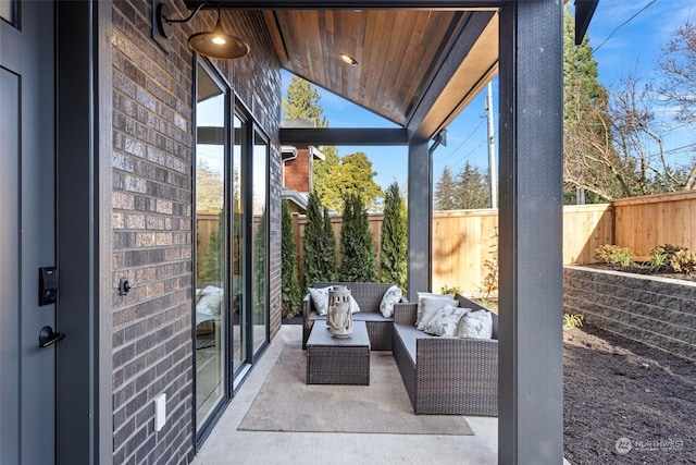 sunroom with wood ceiling and vaulted ceiling