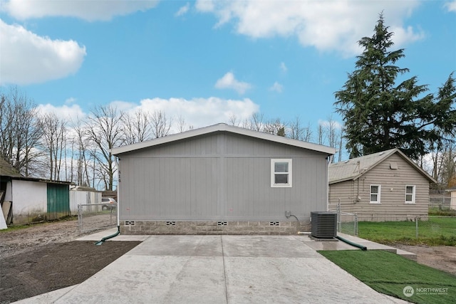 view of side of property featuring central AC unit