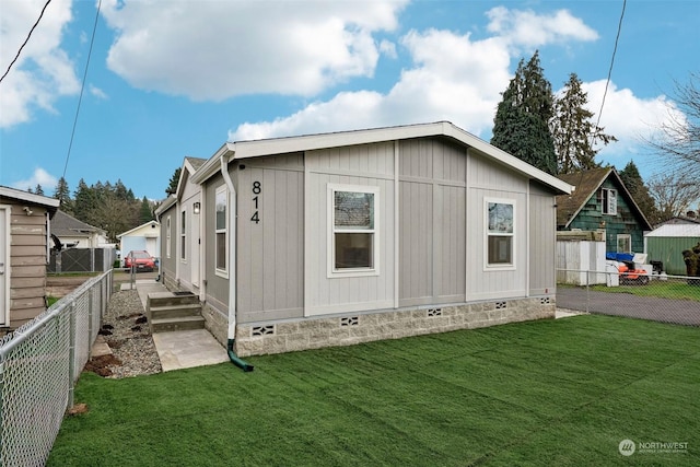 view of home's exterior with a yard