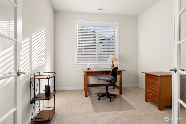 carpeted office with a wealth of natural light