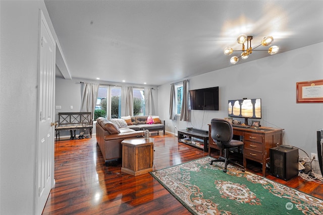 office area with dark wood-type flooring and a notable chandelier