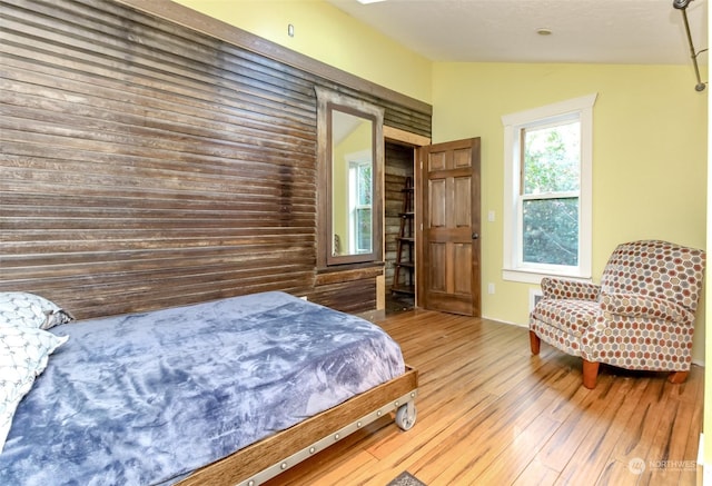 bedroom with wood-type flooring