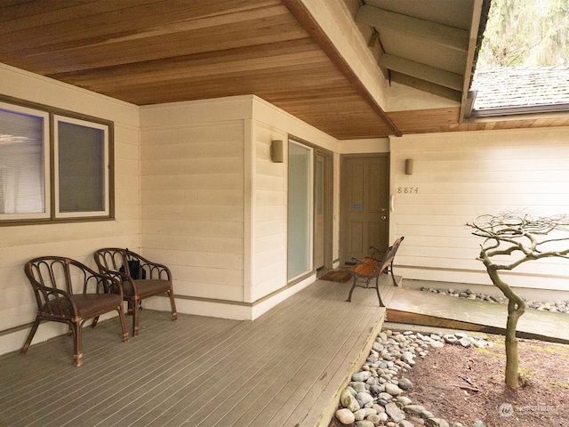 doorway to property featuring a wooden deck