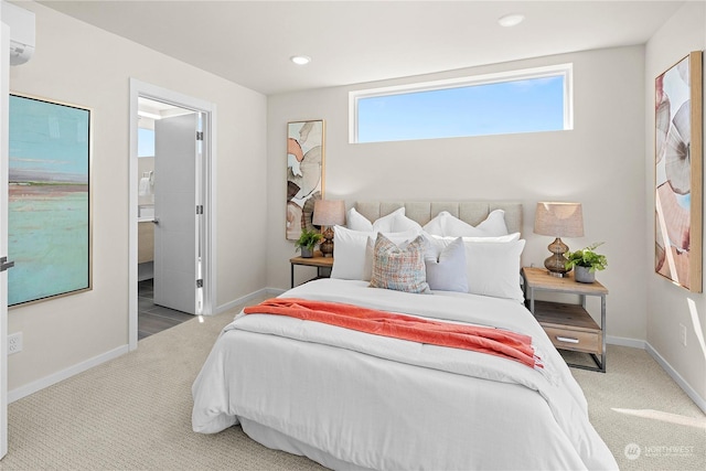 bedroom featuring light colored carpet, connected bathroom, and multiple windows