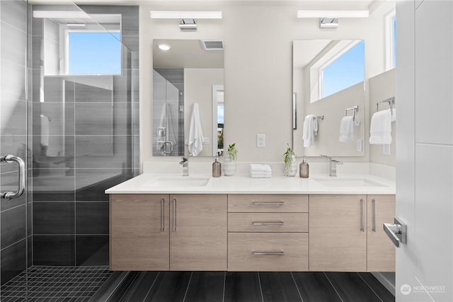 bathroom with vanity and an enclosed shower