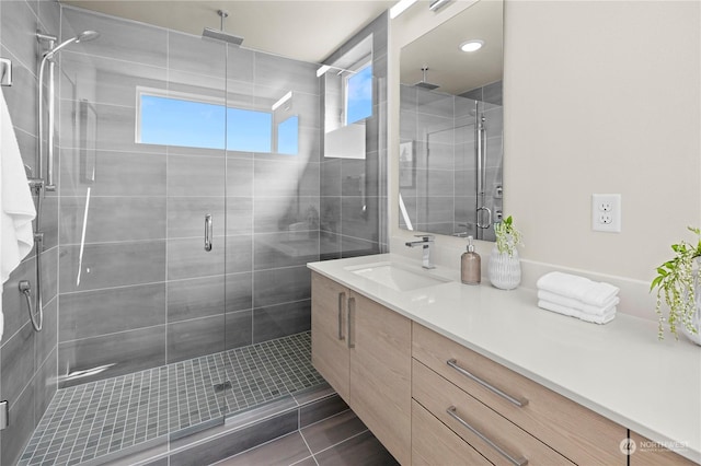 bathroom featuring vanity and walk in shower