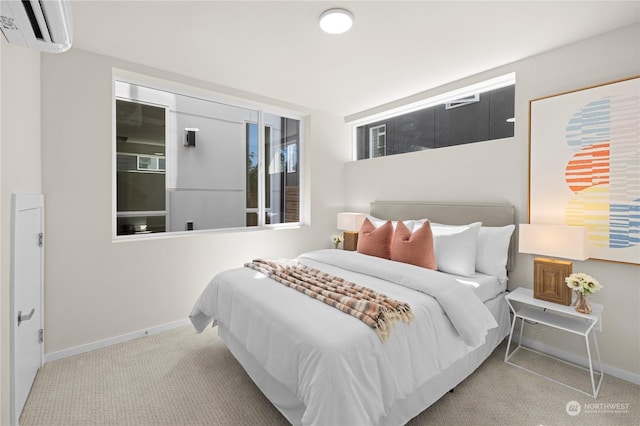 carpeted bedroom with a wall mounted AC