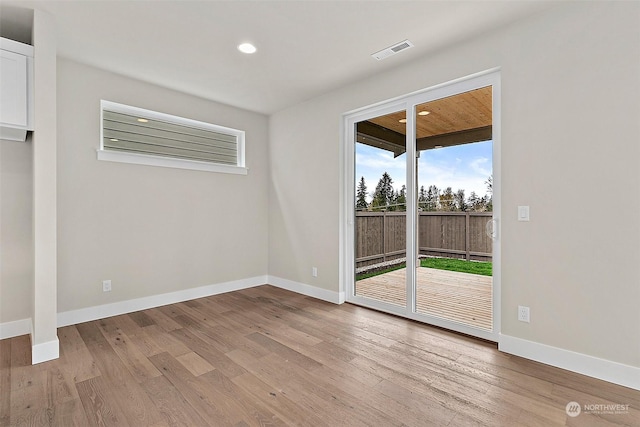 spare room with light wood-type flooring