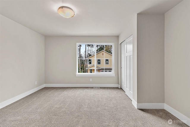 view of carpeted spare room