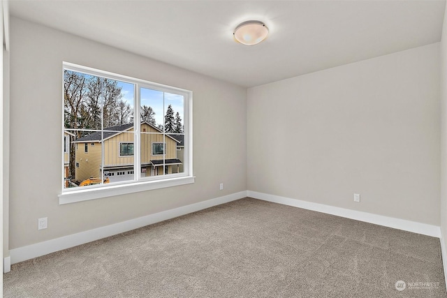 empty room with carpet flooring