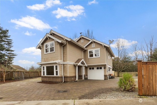 craftsman house with a garage and a patio area