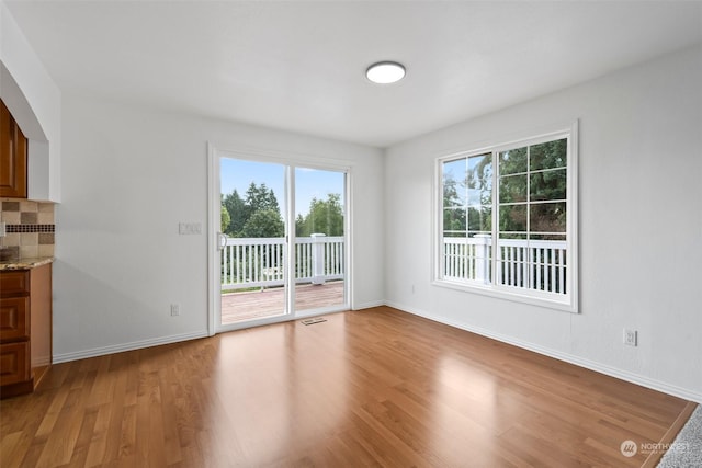 spare room featuring hardwood / wood-style floors