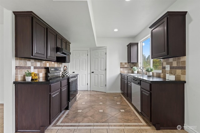 kitchen featuring sink, dark brown cabinets, light tile patterned floors, appliances with stainless steel finishes, and backsplash