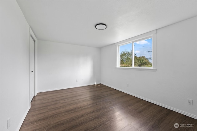 unfurnished bedroom featuring dark hardwood / wood-style flooring