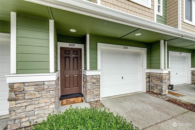 doorway to property featuring a garage