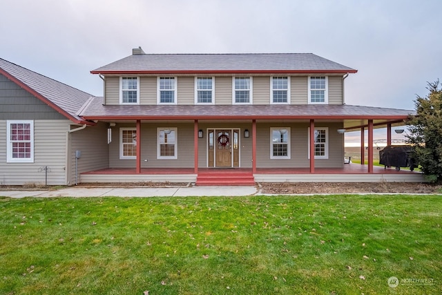 farmhouse inspired home with a porch and a front lawn