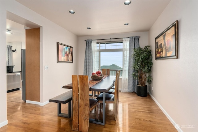 dining space featuring light wood-type flooring