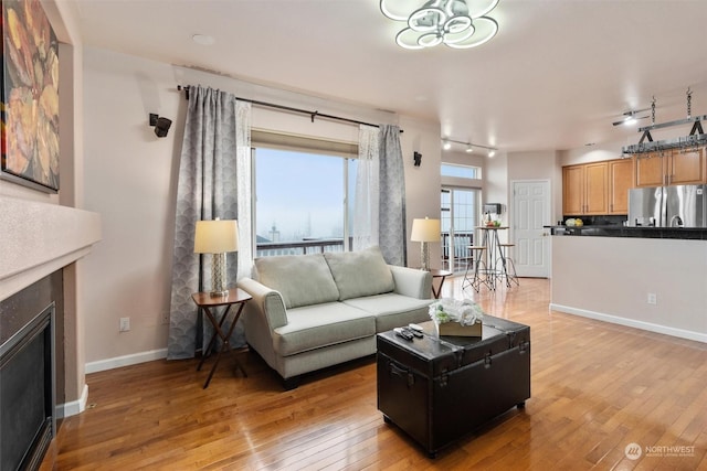 living room with light hardwood / wood-style flooring