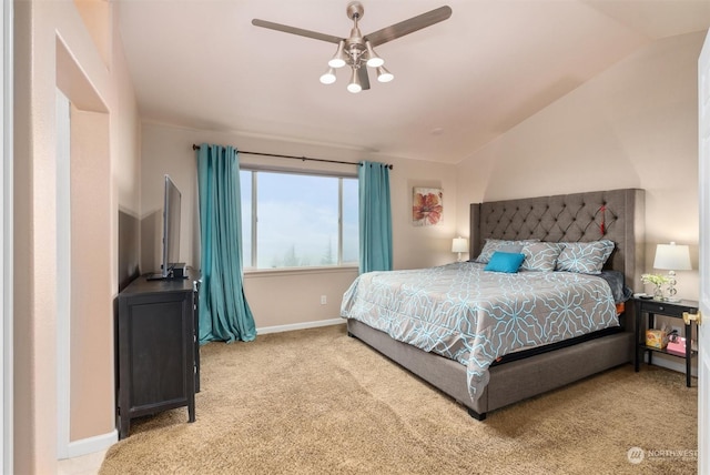 bedroom featuring ceiling fan, carpet, and vaulted ceiling