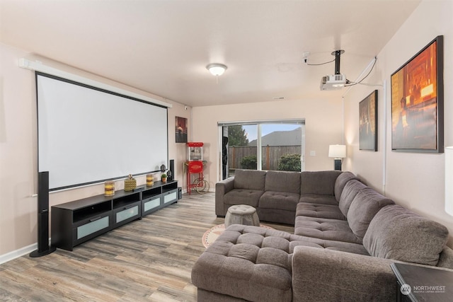 home theater room featuring hardwood / wood-style flooring