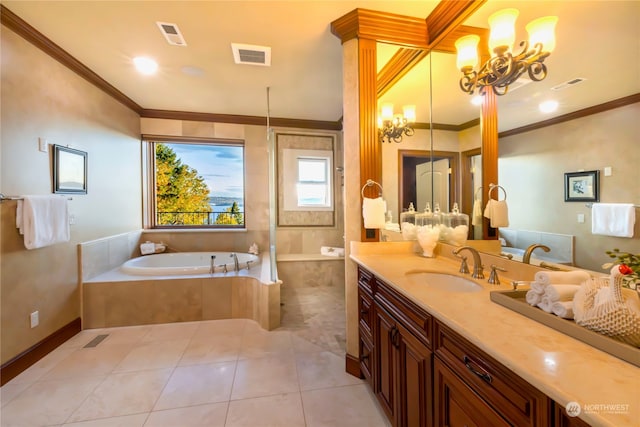 bathroom with vanity, crown molding, tile patterned flooring, and a relaxing tiled tub