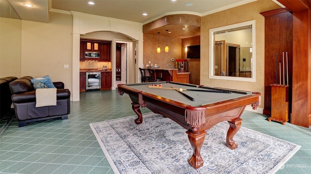 recreation room featuring beverage cooler, tile patterned flooring, crown molding, bar, and pool table