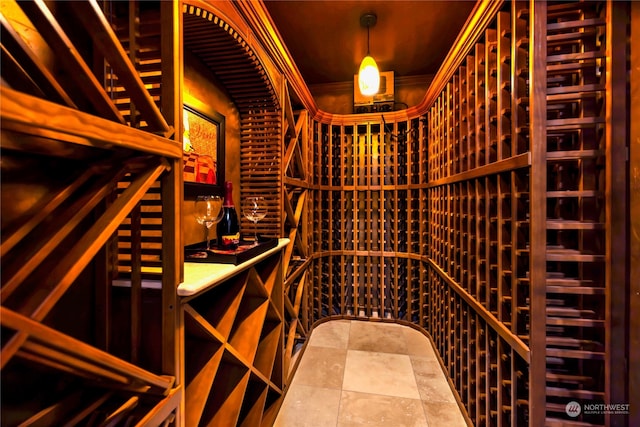 wine room featuring crown molding