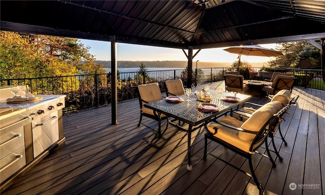 wooden deck with a gazebo and an outdoor living space with a fire pit