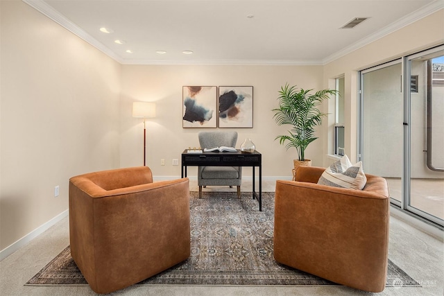 sitting room with carpet floors and crown molding