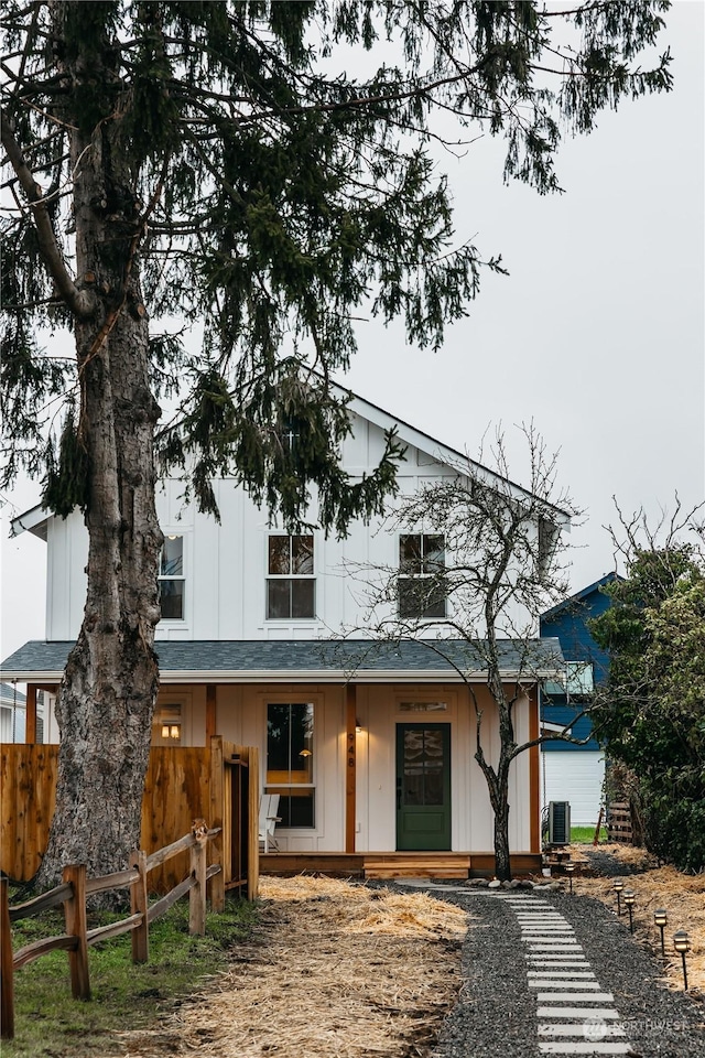 rear view of property featuring central AC