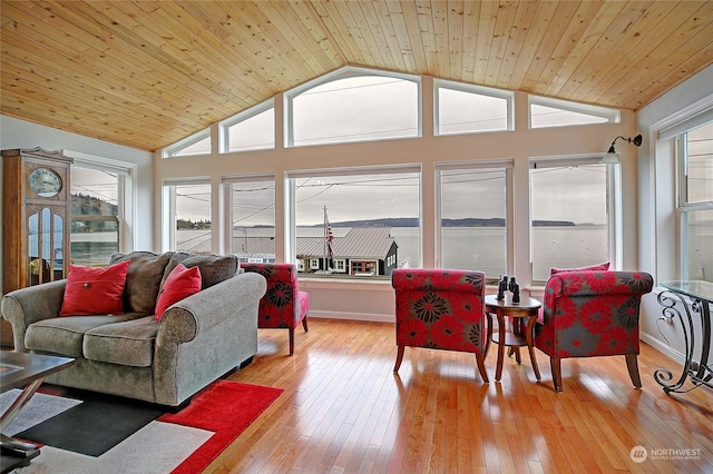 living room featuring wood ceiling, vaulted ceiling, and light wood-type flooring